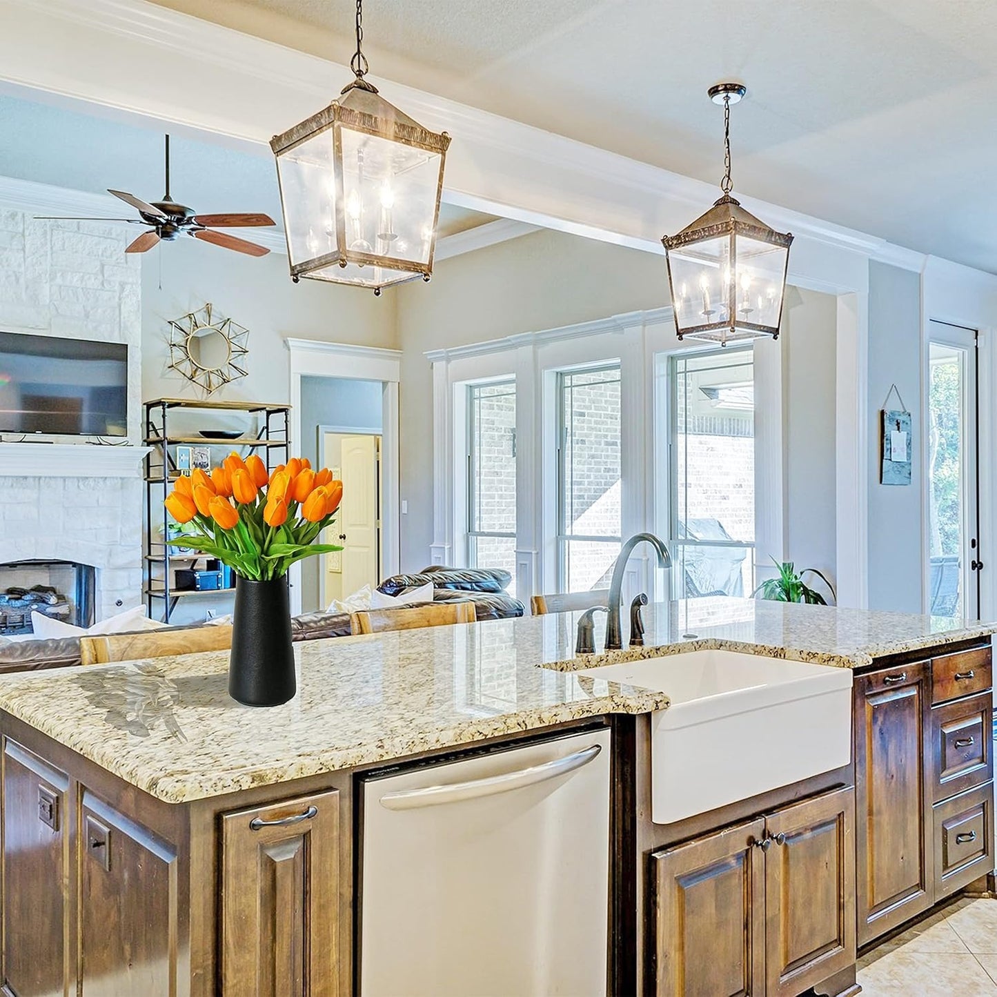 Modern kitchen with wooden cabinets, granite countertops, and a vase of flowers.