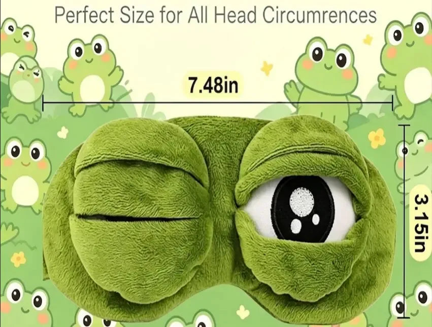 Frog Sleep Mask — A stylish, shimmering sleep mask featuring an adorable "Sad Frog" design. This fun, plush eye mask is perfect for travel, yoga, napping, and light-blocking; its soft cotton lining gently cares for sensitive skin.