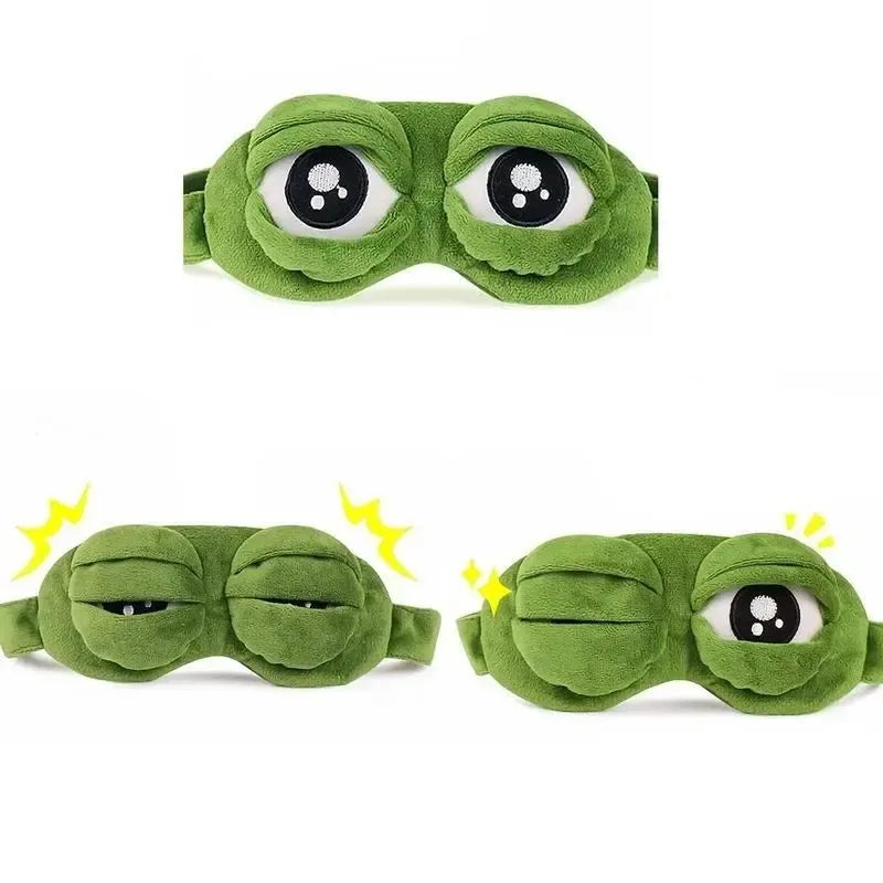 Frog Sleep Mask — A stylish, shimmering sleep mask featuring an adorable "Sad Frog" design. This fun, plush eye mask is perfect for travel, yoga, napping, and light-blocking; its soft cotton lining gently cares for sensitive skin.