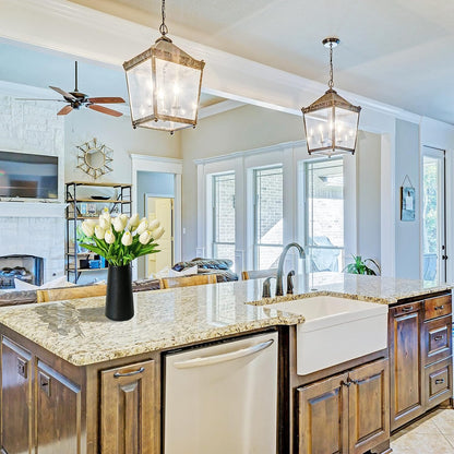 Modern kitchen with wooden cabinets, granite countertops, and a vase of flowers.
