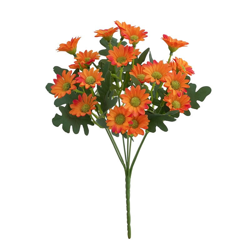 Bouquet of orange flowers with green leaves on a white background