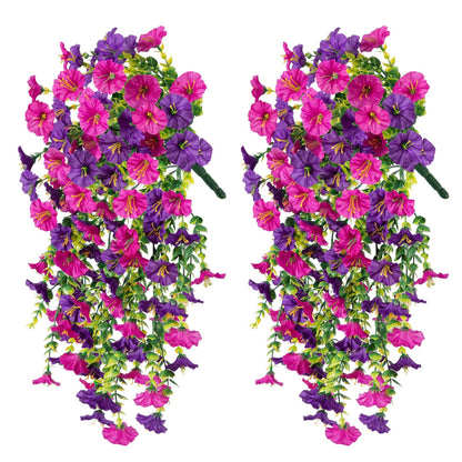 Two artificial hanging flower arrangements with pink and purple flowers on a white background