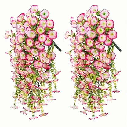 Two sets of pink and green artificial hanging flower arrangements on a white background